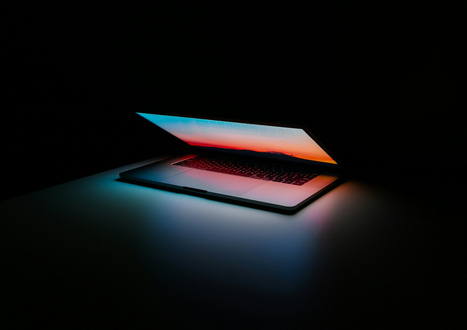 Laptop with vibrant display in the dark